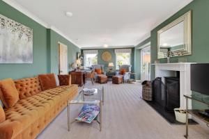 a living room with a couch and a fireplace at 5 Bed in Hereford oc-83658 in Madley