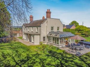 an exterior view of a house with a patio at 5 Bed in Hereford oc-83658 in Madley