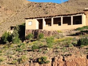 an abandoned house in the middle of a mountain at Gite Chez Brahim Bokyoud in Skoura