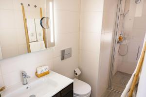 a bathroom with a shower and a sink and a toilet at Casa d'Arcã in Alijó +39 photos