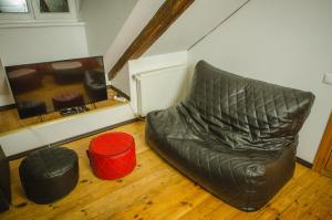 a room with a bean bag chair on a wooden floor at Mansard in Old Town in Riga