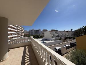 a balcony with a view of a city at Alpen 1 Voramar Playa Norte in Peniscola