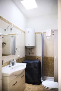 a bathroom with a toilet and a sink and a shower at La Stellina Capri in Capri +18 photos