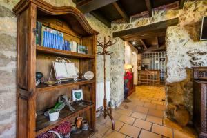 a room with a large wooden book shelf at Amaicha Hotel Rural in Ribadesella