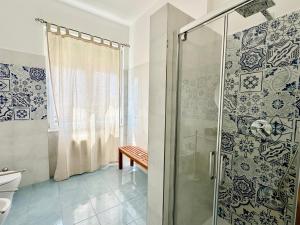 a bathroom with a walk in shower and a toilet at Capraia,Elba in San Vincenzo +32 photos