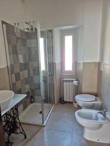 a bathroom with a shower and a toilet and a sink at Punto Zero Ca' Trillina in La Spezia