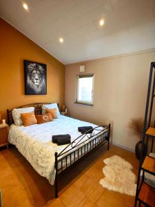 a bedroom with a bed with a dog on it at Le Rensy in Ferrières +48 photos