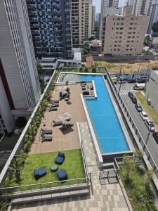 an overhead view of a swimming pool in a city at Studio Tatuapé - SP in São Paulo