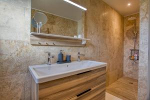 a bathroom with a sink and a mirror at Le Nid du Coderc in Carsac-Aillac +14 photos