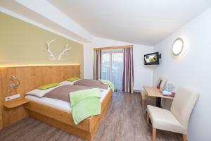 Postel nebo postele na pokoji v ubytování Comfort Hotel Garni Landhaus Gitti