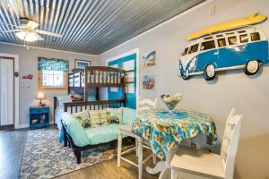 a childs room with a bunk bed and a table at 1 Mi to Ocean Isle Beach! Studio w/ Outdoor Oasis in Ocean Isle Beach