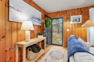 a living room with a couch and a tv at The Coast: Cozy Cape Escape in Dennis Port in Dennis Port +29 photos