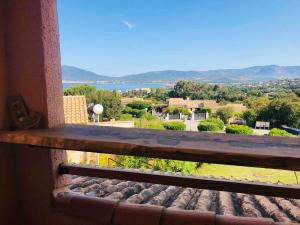 a view from the window of a house with a view at Casamea - T2, Piscine, Vue Mer, Clim, Balcon in Porticcio +56 photos