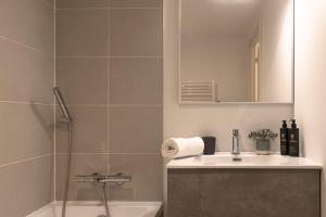a bathroom with a shower and a sink and a mirror at Apartment Leo - 2BR, Modern, Lift access, Mountain views in Les Houches +15 photos