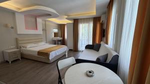 a hotel room with a bed and a couch at Arya Otel in Marmaris +79 photos