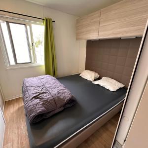 a bunk bed in a room with a window at Blueportel Prestige in Le Portel
