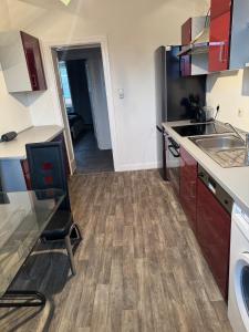 a kitchen with a sink and a counter at Leo, apartment in Wasserbillig
