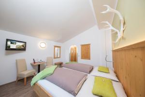 Postel nebo postele na pokoji v ubytování Comfort Hotel Garni Landhaus Gitti