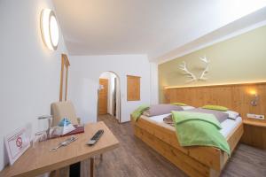 Postel nebo postele na pokoji v ubytování Comfort Hotel Garni Landhaus Gitti