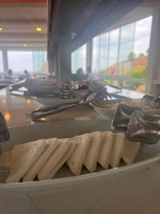a bunch of food on a counter in a cafeteria at Mercan Otel in Çanakkale