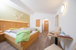 Postel nebo postele na pokoji v ubytování Comfort Hotel Garni Landhaus Gitti