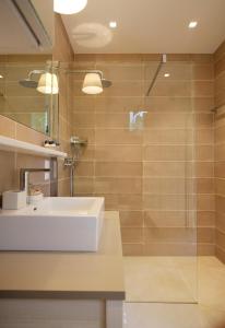 a bathroom with a sink and a shower at Auszeit Koppi in Apetlon +20 photos