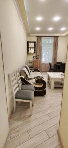 a living room with two beds and a couch at H apartment in Yerevan
