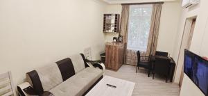 a living room with a couch and a table at H apartment in Yerevan