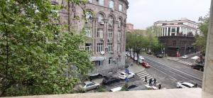 a view of a city street with cars and buildings at H apartment in Yerevan