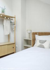 a bedroom with a bed and a dresser at Casa Arcangel in Castiello de Jaca