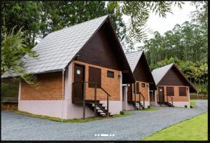 a group of cottages with stairs in front of them at Pousada Casarão Gastehaus in Pomerode +46 photos