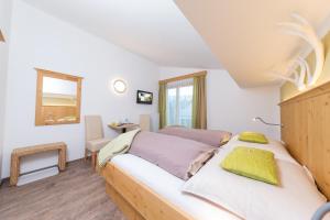 Postel nebo postele na pokoji v ubytování Comfort Hotel Garni Landhaus Gitti