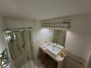 a bathroom with a sink and a shower at Residence Porto Rotondo in Porto Rotondo +28 photos