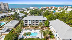 an aerial view of a resort with a pool and the ocean at VitaminSeaGrove in Santa Rosa Beach