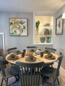 a dining room with a table with chairs at No 3 Chapel Row in Bakewell +18 photos