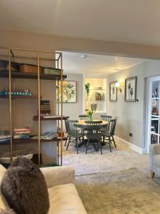 a living room with a table and chairs at No 3 Chapel Row in Bakewell