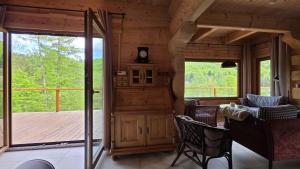 a room with a large glass door and a deck at Sarnia CHATA in Brenna