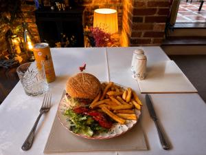 a plate of food with a sandwich and french fries at The Beaumont in Sittingbourne +19 photos