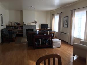 a living room with a couch and a fireplace at Apartamento Senadomum in Seia