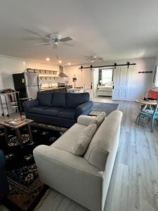 a living room with two couches and a couch at Chucks Cottage in Cape Charles in Cape Charles