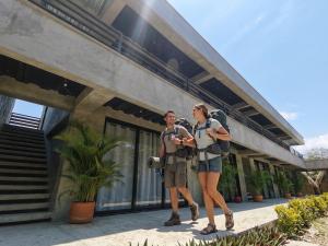 a man and a woman standing outside of a building at Palomino Sunrise in Palomino