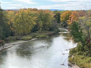 a view of a river with a boat in it at Wasaga Dunes in Wasaga Beach