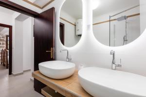 a bathroom with a large white sink and a mirror at Casa del Sol in Strp +10 photos