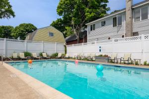 a swimming pool with colorful balls in the water at Bar Harbor Villager Motel - Downtown in Bar Harbor