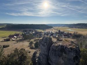 a small village in a field with large rocks at Loft Fischbach bei Kallmünz 2 Schlafzimmer in Kallmünz