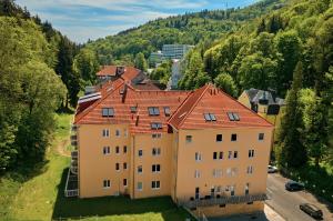 an aerial view of a large building with red roof at Apartment Schober - Rezidence K Lanovce in Jáchymov