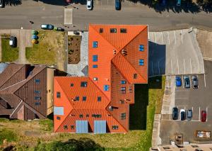 an orange building with a x on top of it at Apartment Schober - Rezidence K Lanovce in Jáchymov
