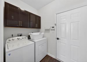 a white kitchen with a stove and a white door at Spacious Family Gathering Space Privacy Zones Quiet, Convenient Neighborhood in Middletown