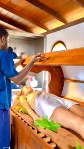 a man in a bunk bed with a woman on it at LakRaj Heritage in Matara
