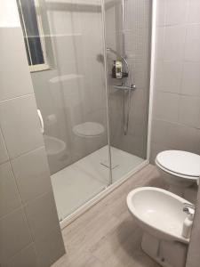 a bathroom with a shower and a toilet and a sink at La Voltina in Diecimo +16 photos